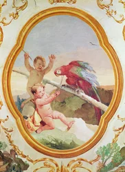 To putti leger med en papegøje